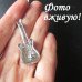 Серебристая брошь в стразах Гитара
